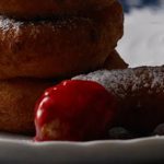 Cheese doughnuts with raspberry sauce