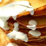 Carrot Pancakes with Cheese Sauce