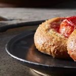 Yeast buns with prunes and caramelized pear